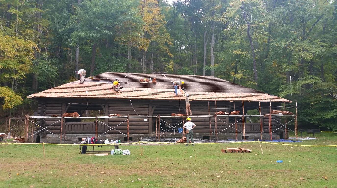 Western red cedar shake roofing installation and restoration in Pacific Northwest pine forest